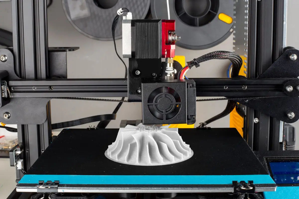 3D printer creating a white object.